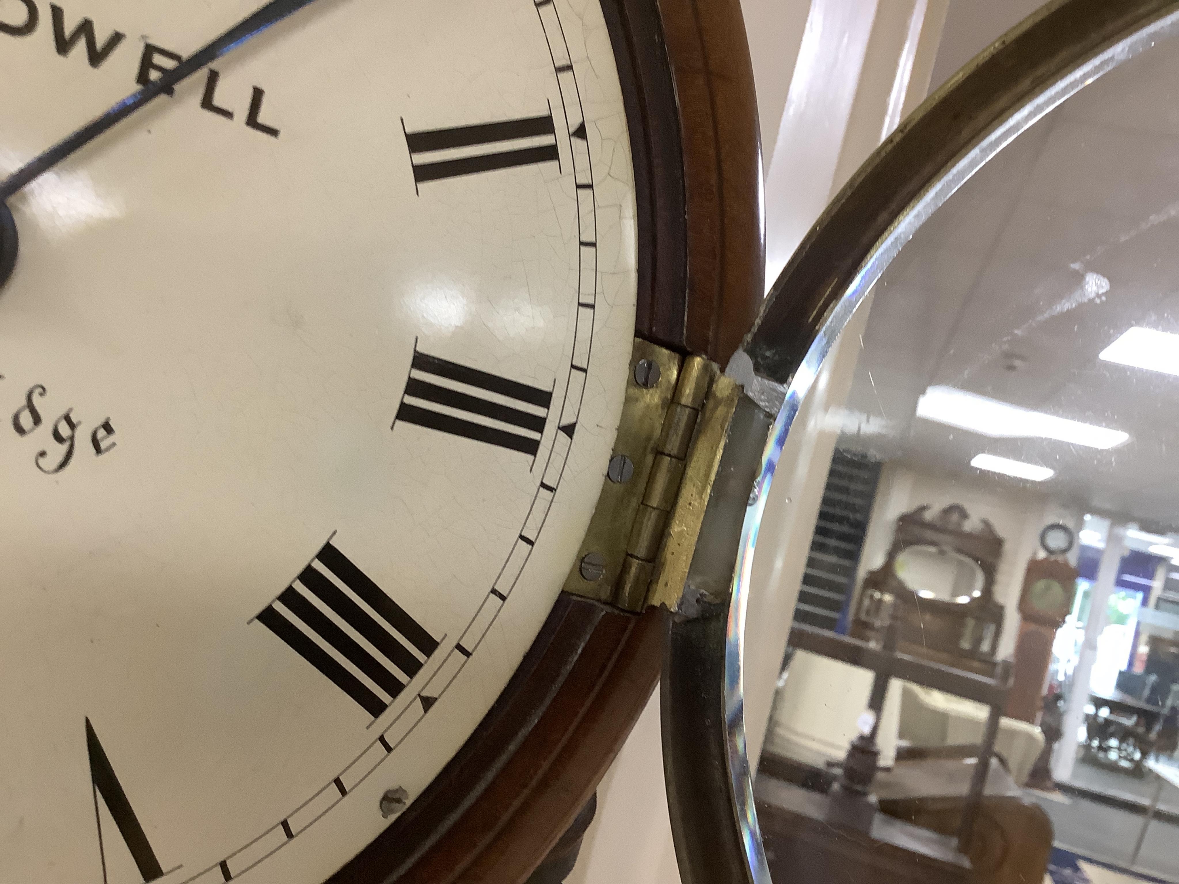 A mid 19th century small mahogany cased drop dial wall clock by Crundwell of Tunbridge, with key and pendulum, 37cm high. Condition - fair to good. Not tested as working